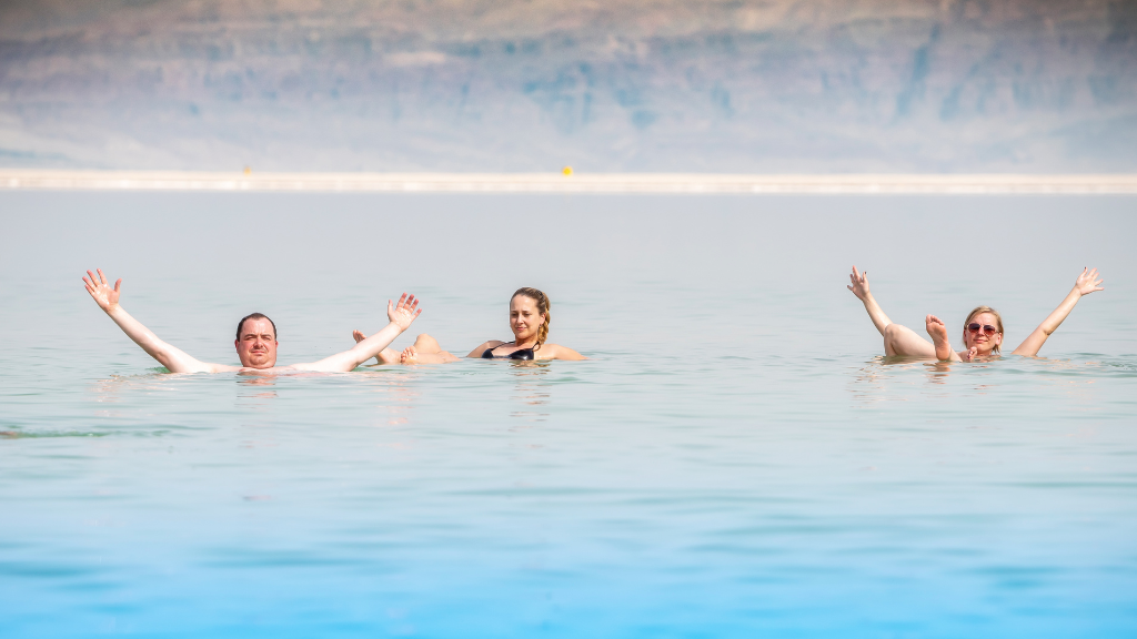 Group of People Floating On Dead Sea