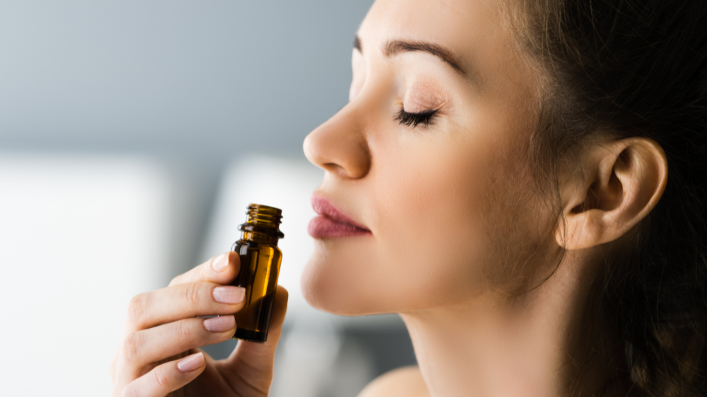 Woman Sniffing Essential Oil